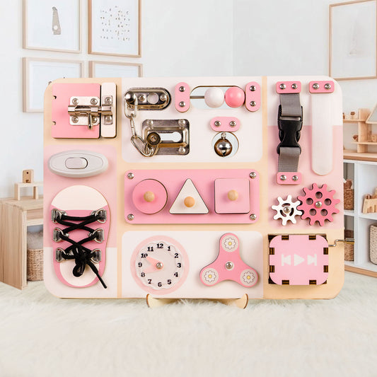 Pink and wooden activity board with various educational elements on a light background